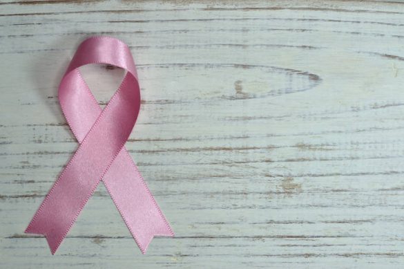 A pink ribbon is shown in honor of breast cancer awareness month
